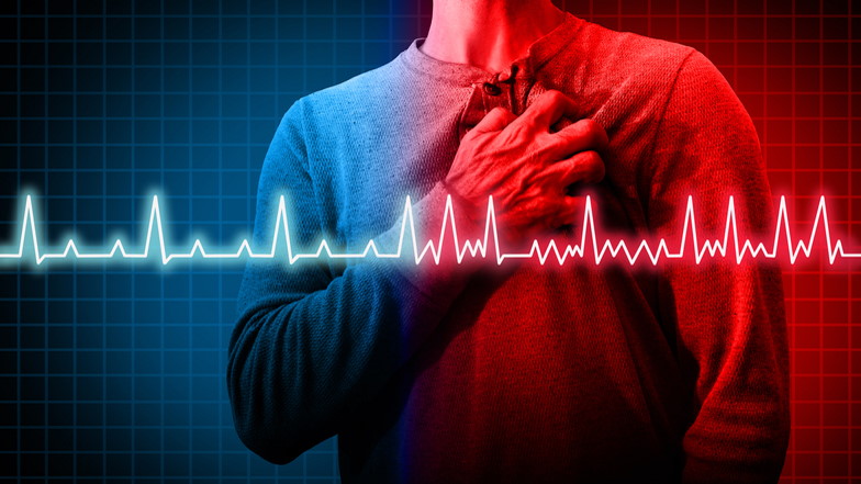 Mann greift sich ans Herz, EKG-Linie zeigt Herzprobleme